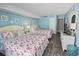 This cheerful bedroom is decorated with ocean themed artwork and two beds with flamingo bedding at 9820 Queensway Blvd. # 704, Myrtle Beach, SC 29572