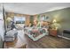 Cozy bedroom with a balcony, colorful bedding, and stylish decor at 9820 Queensway Blvd. # 704, Myrtle Beach, SC 29572