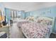 Charming bedroom featuring two beds, balcony views, and light blue walls for a relaxing atmosphere at 9820 Queensway Blvd. # 704, Myrtle Beach, SC 29572