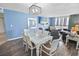 Cozy dining area with a modern table and chairs, open to the living room at 9820 Queensway Blvd. # 704, Myrtle Beach, SC 29572
