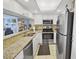 Modern kitchen with stainless steel appliances, granite counters, and ample cabinet space at 9820 Queensway Blvd. # 704, Myrtle Beach, SC 29572