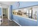 Bright kitchen featuring stainless steel appliances, granite countertops, and white cabinetry at 9820 Queensway Blvd. # 704, Myrtle Beach, SC 29572