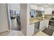 Open kitchen concept with stainless steel appliances and a view into the living area at 9820 Queensway Blvd. # 704, Myrtle Beach, SC 29572