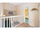 Hallway with stairway, leading to the bedroom with yellow walls at 1012 Possum Trot Rd. # F 42, North Myrtle Beach, SC 29582
