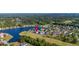 A birds eye view of a housing community with a gorgeous lake, golf course, and mature trees at 1017 Gallinule Dr., Conway, SC 29526