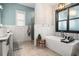 Luxurious bathroom with freestanding tub, glass shower, and modern fixtures, complemented by natural light at 1017 Gallinule Dr., Conway, SC 29526