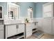 Elegant bathroom with double vanity, stylish mirrors, modern fixtures, and neutral color palette at 1017 Gallinule Dr., Conway, SC 29526