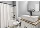 Modern bathroom with a vessel sink on granite counters, complemented by a shower with a curtain at 1017 Gallinule Dr., Conway, SC 29526