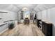 Attic bonus room featuring neutral paint, wood floors, a large chandelier, and a bright window at 1017 Gallinule Dr., Conway, SC 29526