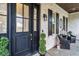 Inviting entryway featuring a stylish front door, brick facade, and charming decor at 1017 Gallinule Dr., Conway, SC 29526