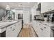Bright kitchen featuring a center island, white cabinetry, stainless appliances, and modern fixtures at 1017 Gallinule Dr., Conway, SC 29526