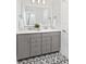 Bathroom features a double sink vanity, decorative tile floor, and modern fixtures at 1071 Milford Way, Myrtle Beach, SC 29588