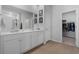 Bright bathroom featuring a double sink vanity and entry to the walk-in closet at 109 River Vista Way, Myrtle Beach, SC 29588