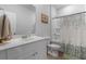 Well-lit bathroom with a vanity, toilet, and shower with a curtain at 109 River Vista Way, Myrtle Beach, SC 29588