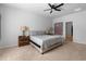 Comfortable bedroom with a ceiling fan, a queen-sized bed, and stylish bedside lamps at 109 River Vista Way, Myrtle Beach, SC 29588