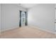 This bedroom with neutral colored walls and carpeting features a window at 109 River Vista Way, Myrtle Beach, SC 29588