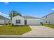 Charming single-story home with a well-maintained lawn and attached two-car garage at 109 River Vista Way, Myrtle Beach, SC 29588