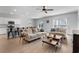 Open concept living room with breakfast bar, kitchen, and dining area features modern design at 109 River Vista Way, Myrtle Beach, SC 29588