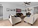 Inviting living room with stylish furnishings, a ceiling fan, and a decorative bar area perfect for entertaining at 109 River Vista Way, Myrtle Beach, SC 29588