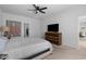 Spacious main bedroom with large bed, wooden dresser, and contemporary art at 109 River Vista Way, Myrtle Beach, SC 29588