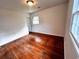 This is a basic bedroom with walls painted off white and one window at 1110 Scott Dr., Myrtle Beach, SC 29577