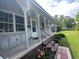 Inviting front porch featuring classic columns, brick steps, and tasteful landscaping at 1110 Scott Dr., Myrtle Beach, SC 29577