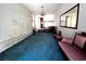 Bright living room with a chandelier, sofa, and a large mirror at 1110 Scott Dr., Myrtle Beach, SC 29577