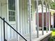Detailed view of the home's porch columns, siding, and adjacent property at 1110 Scott Dr., Myrtle Beach, SC 29577