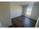 Bedroom with dark hardwood floors and a window at 116 Forman Way, Aynor, SC 29511