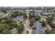 An aerial view of a coastal neighborhood, featuring colorful homes and mature trees near a sandy beach at 118A 6Th Ave. N, Surfside Beach, SC 29575