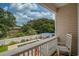 Balcony with a view of a private pool area, trees, and a sunny sky at 118A 6Th Ave. N, Surfside Beach, SC 29575