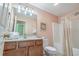 Bright bathroom with a tub shower combo at 118A 6Th Ave. N, Surfside Beach, SC 29575