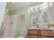 Bathroom featuring wood cabinets, a shower with a handheld shower head, and tiled flooring at 118A 6Th Ave. N, Surfside Beach, SC 29575