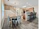 Open-concept dining room features a large table and seamlessly connects to the kitchen area with barstool seating at 118A 6Th Ave. N, Surfside Beach, SC 29575