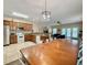 Open kitchen and dining area featuring wood cabinets, granite countertops, and stainless steel appliances at 118A 6Th Ave. N, Surfside Beach, SC 29575
