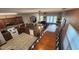 Spacious living area with a dining table, cozy seating, and a kitchen with stainless steel appliances at 118A 6Th Ave. N, Surfside Beach, SC 29575