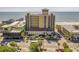 Exterior shot of a coastal building with beach views and easy access to nearby pier at 1200 N Ocean Blvd. # 710, Myrtle Beach, SC 29577