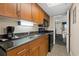 Well-equipped kitchen featuring granite countertops, modern appliances, and ample cabinet space at 1200 N Ocean Blvd. # 710, Myrtle Beach, SC 29577