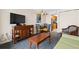 Comfortable living area with TV, furnishings, and dining set, leading to a well-equipped kitchen at 1200 N Ocean Blvd. # 710, Myrtle Beach, SC 29577