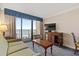 Living room with cozy sofa and ocean view, perfect for relaxing and enjoying beach scenery at 1200 N Ocean Blvd. # 710, Myrtle Beach, SC 29577