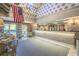 View of the lobby with stone-styled reception desk, modern patterned ceiling, and American flag hanging at 1200 N Ocean Blvd. # 710, Myrtle Beach, SC 29577