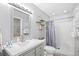 Well-lit bathroom featuring a gray vanity, modern fixtures, and a shower-tub combination for a functional and stylish space at 1204 River Oak Dr. # 25-A, Myrtle Beach, SC 29579