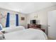 Shared bedroom featuring two twin beds, dinosaur themed decorations, and a dresser with a television at 1204 River Oak Dr. # 25-A, Myrtle Beach, SC 29579