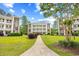 Building 21 with manicured front lawn in between other similar buildings at 1204 River Oak Dr. # 25-A, Myrtle Beach, SC 29579