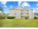 Beautiful building exterior with large lawn, three stories and decks on each level at 1204 River Oak Dr. # 25-A, Myrtle Beach, SC 29579