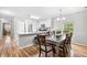 Charming kitchen with white cabinetry, stainless steel appliances, and an adjacent dining area at 1204 River Oak Dr. # 25-A, Myrtle Beach, SC 29579