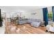 Open-concept living area featuring hardwood floors, a gray sofa, and a dining area at 1204 River Oak Dr. # 25-A, Myrtle Beach, SC 29579