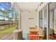 Cozy outdoor patio with wood furniture, decorative lights, and a view of the surrounding landscape at 1204 River Oak Dr. # 25-A, Myrtle Beach, SC 29579