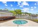 Inviting outdoor hot tub and neighborhood pool with nearby condos, perfect for warm weather at 1204 River Oak Dr. # 25-A, Myrtle Beach, SC 29579