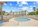 Inviting outdoor hot tub and neighborhood pool with nearby condos, perfect for warm weather at 1204 River Oak Dr. # 25-A, Myrtle Beach, SC 29579